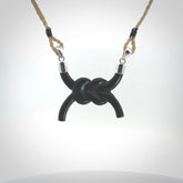 A gorgeous hand carved black jade reef knot pendant with sterling silver. Hand made in Black Jade with Sterling Silver and provided with adjustable cord.